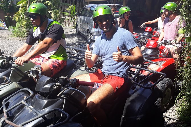 Bali ATV Rafting And Ubud Waterfall Private Tour - ATV riding through mud, streams, and rice fields