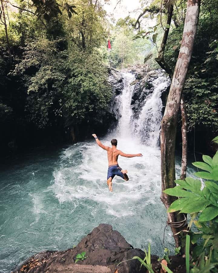 Bali: Cliff Jumping Gitgit Waterfalls & Rice Terrace Tour - Gitgit Waterfall through forest paths