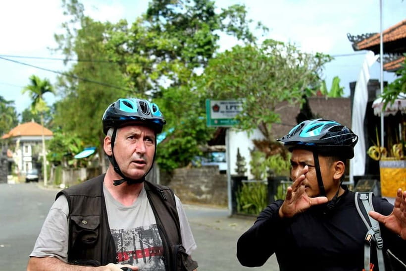Bali: Kintamani Downhill Bike Tour, Jungle and Waterfalls - Temples, sacred cattle, and Balinese beliefs