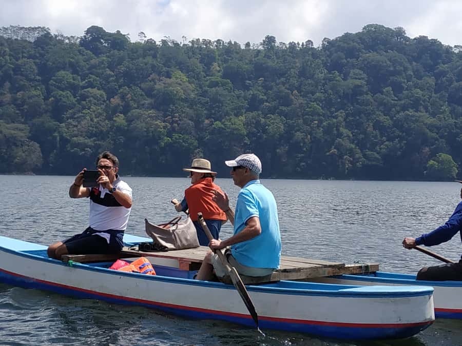 Bali: Munduk Waterfalls Trek, Twin Lakes and Temple Tour - A quiet wooden canoe across Tamblingan Lake