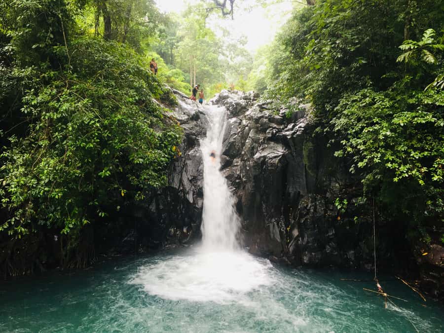 Bali: Sambangan Waterfalls Trekking, Sliding, & Jumping Trip - Sliding 12 meters at Kroya Waterfall