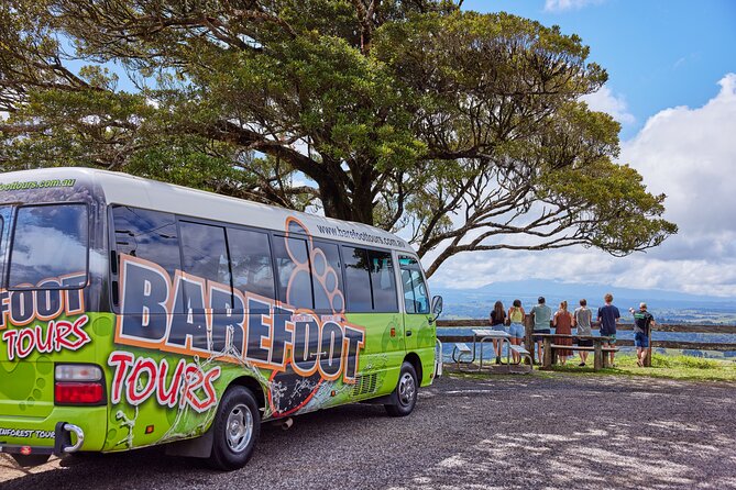 Barefoot Atherton Tablelands Adventure by Cairns Waterfalls - Lake Eacham, a volcanic crater filled with clear water