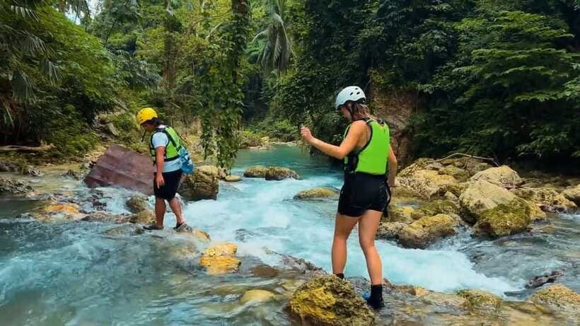 Cebu: Kawasan Falls Canyoneering Tour with Ziplining & Lunch - Reaching the multi-tiered falls