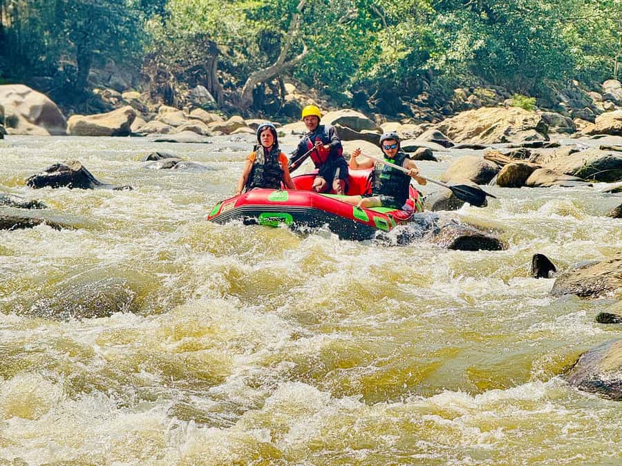 Chiang Mai: Sticky Waterfall and Rafting Day Trip - A calm bamboo raft near elephant sanctuaries