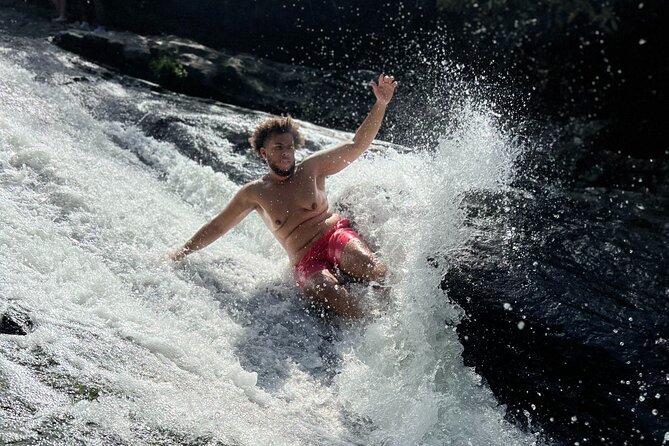 El Yunque Waterslide and Waterfall Tour with Food and Photos - Sliding, swimming, and waterfall time