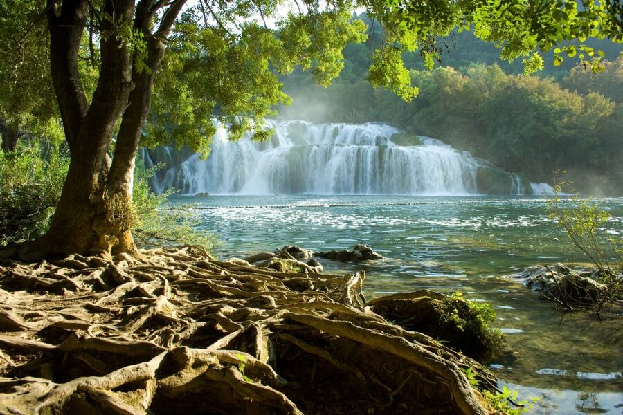 From Omiš: Krka Waterfalls and Trogir Group Tour - Transport, group size, and the early start
