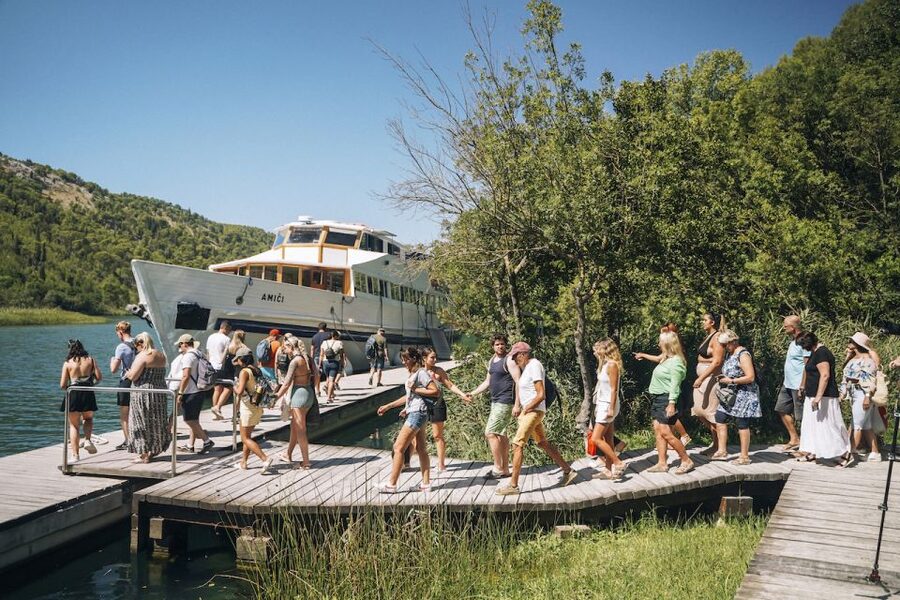 From Split: Krka Waterfalls Tour with Boat Cruise & Swimming - What the guide adds to the day