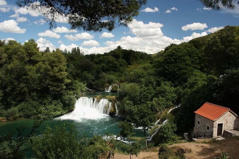 From Split: Krka Waterfalls with Riverboat Ride & swimm stop - Why the Riverboat Makes Krka Feel Special