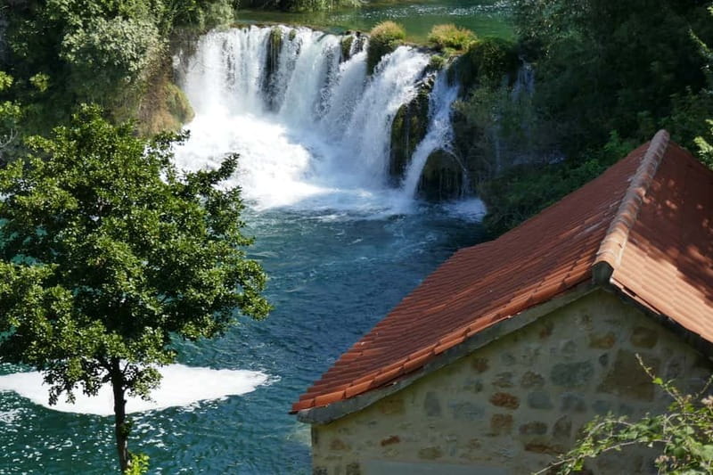 From Split: Krka Waterfalls with Riverboat Ride & swimm stop - The 80-Minute Ride from Split