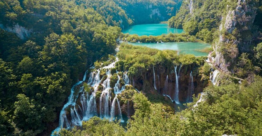 From Split or Trogir: Plitvice Lakes Guided Tour - Entering the park and finding the waterfalls