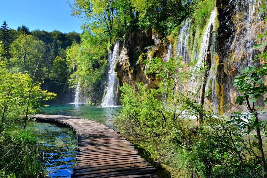 From Split: Plitvice Lakes Fully-Guided Day Tour - Taking the boat through the Lower Lakes