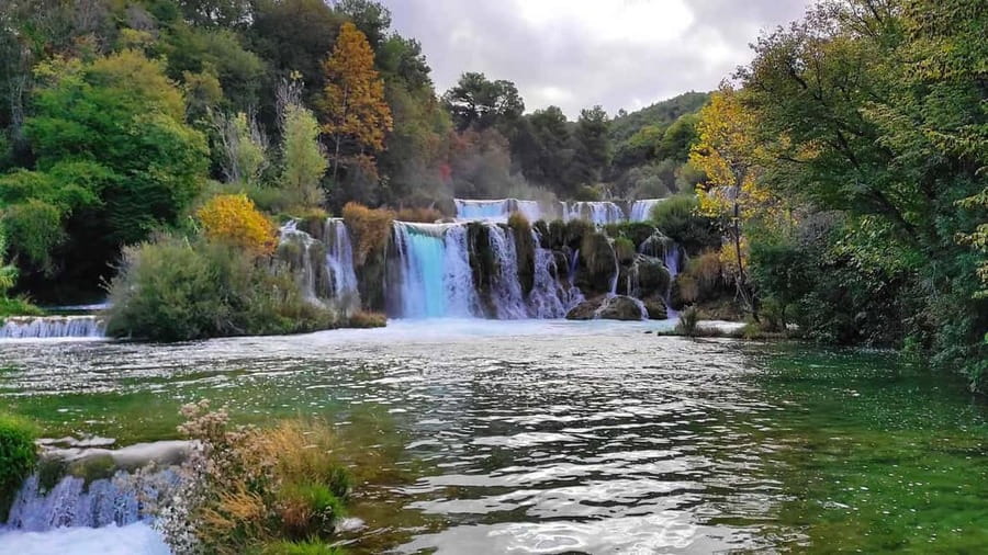 From Trogir, Seget & Okrug: Krka Waterfalls Culture Tour - Entering Krka through Lozovac