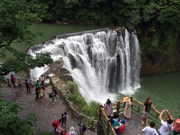 Half Day Private Tour to Jiufen, Shifen Waterfall & Pingxi Sky Lantern - The gold-colored water at Golden Waterfall
