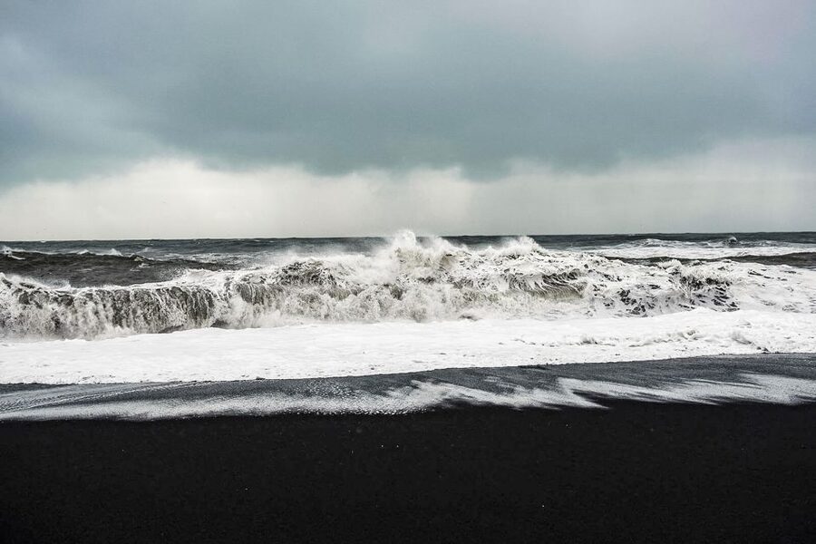 Iceland: Full-Day South Coast, Black Beach & Waterfalls Tour - Reynisfjara, black sand, and a serious safety lesson