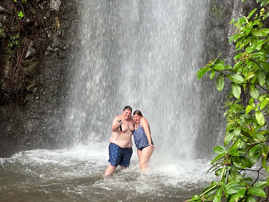 Kingstown: Cascading Dark View Falls and Beach Tour - Standing beneath the lower cascade