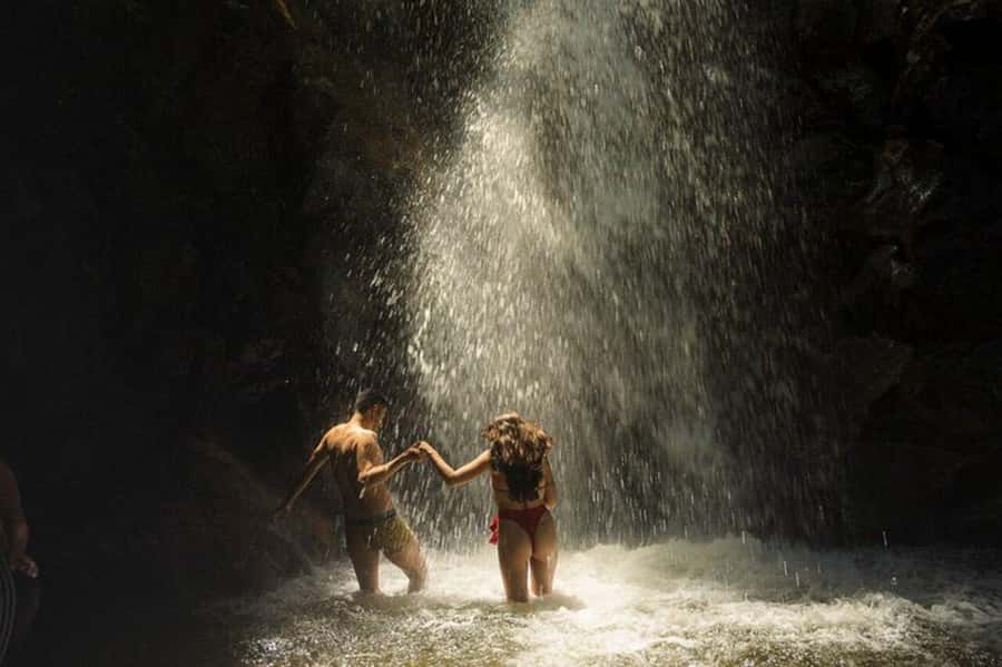 Medellín: Secret Waterfall Hike Tour with Snack and Coffee - Reaching the waterfall and getting wet
