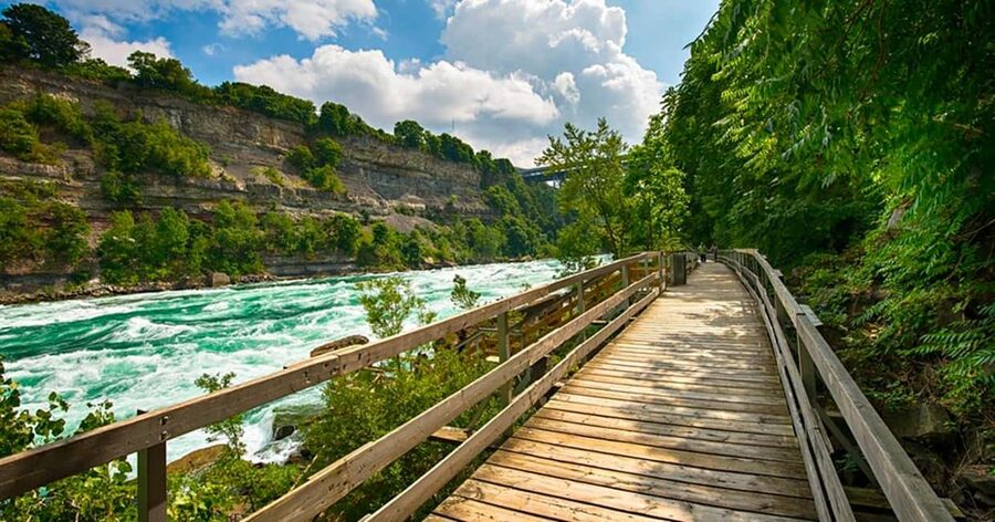 Niagara Falls: 5 Attraction Pass, WEGO Bus & Audio Guide - Whirlpool Aero Car crosses above the rapids