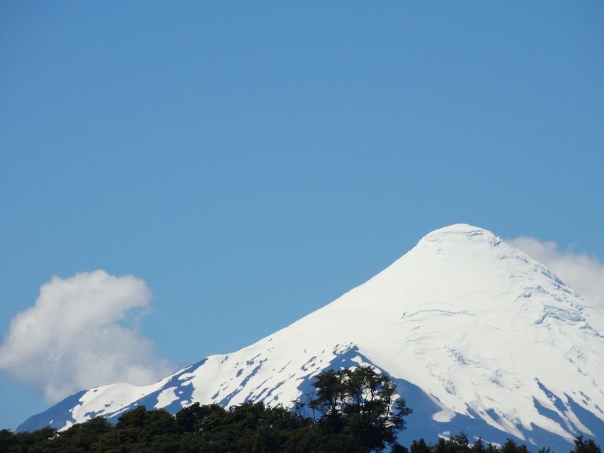 Puerto Montt: Osorno Volcano and Petrohué Falls Guided Tour - Petrohué Falls and water over ancient lava