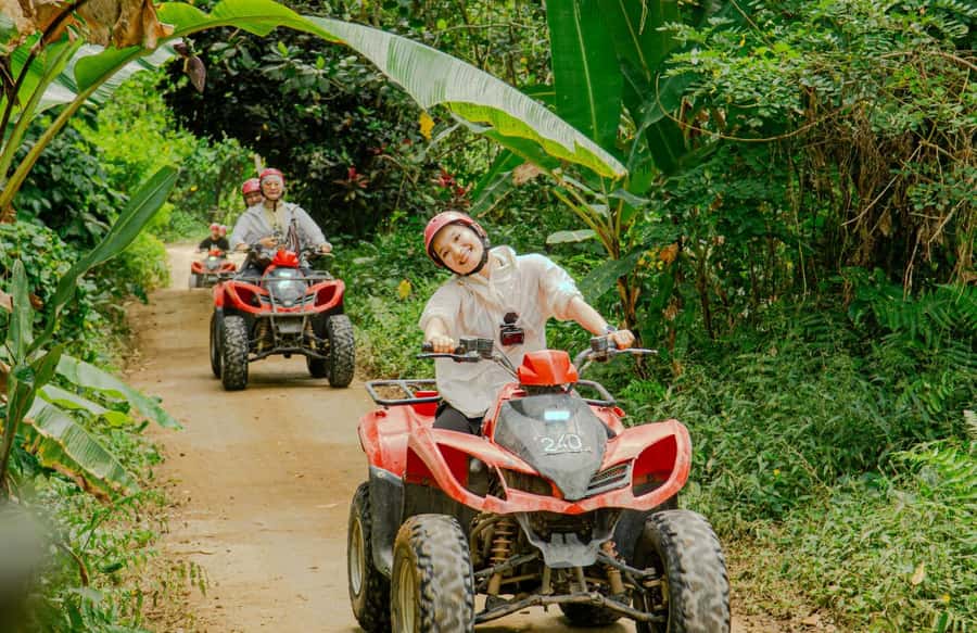 Quad Bike Bali With Tunnel & Waterfall Tour - Waterfall, river crossings, and photo stops