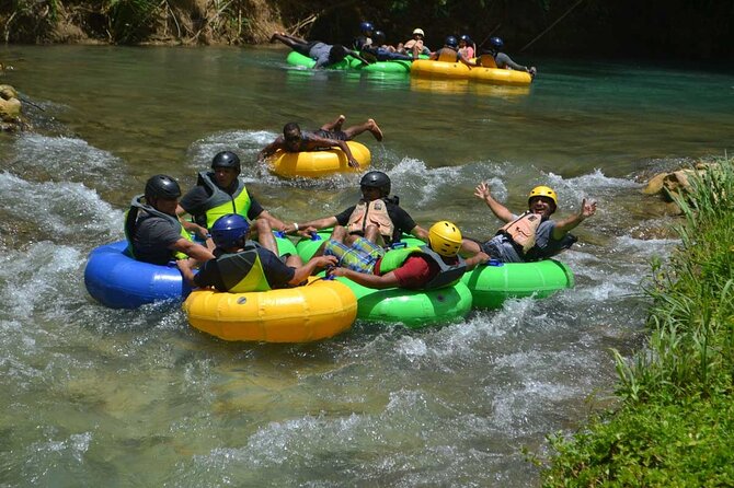 River Rapids Waterfalls Tubing and Beach Adventure with Transport - Calm water, small rapids, and bamboo shade