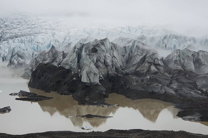 South Coast Waterfall, Black Beach, Glacier Adventure Small Group - Gljufrabui: a short walk to a tucked-away waterfall