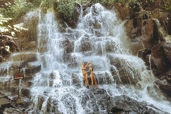 Tanah Lot Temple, Waterfall & Ubud Tour (Private & All-Inclusive) - Kanto Lampo Waterfall and its black rock shelves
