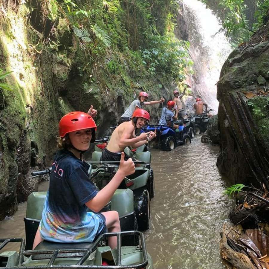 Ubud: Jungle, Waterfall, and Tunnel ATV Tour & Lunch Options - Riding beneath the waterfall